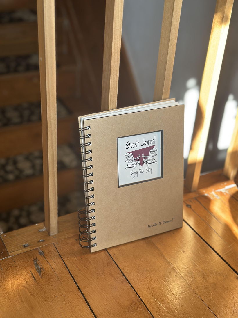 The Snuggery's handwritten guest journal, open on a table